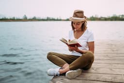 Text on the beach: How your holiday read can be key to your self-improvement